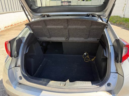 Empty car boot with a dark interior and no visible items.